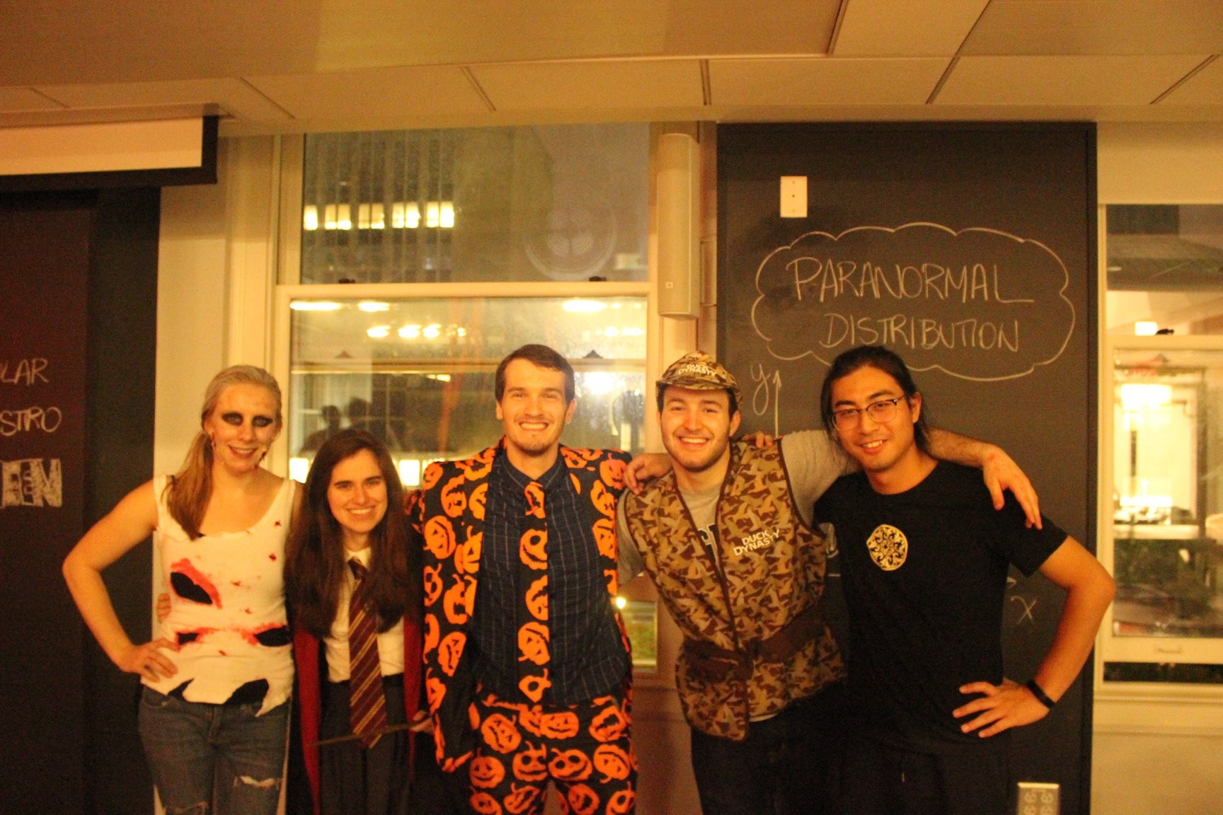 5 students wearing Halloween costumes